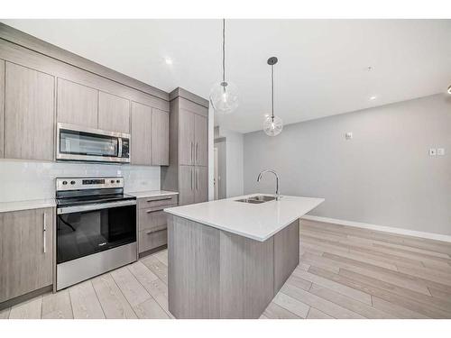1307-681 Savanna Boulevard Ne, Calgary, AB - Indoor Photo Showing Kitchen With Stainless Steel Kitchen With Upgraded Kitchen