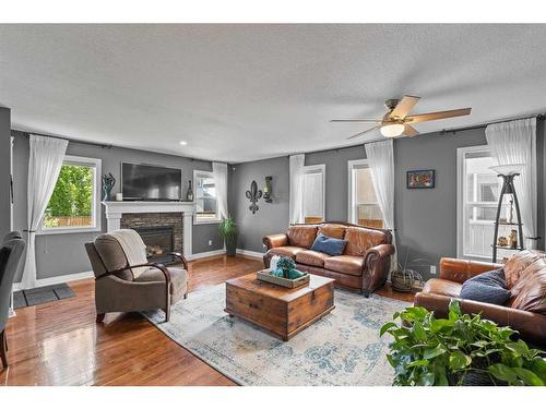 24 Cranleigh Drive Se, Calgary, AB - Indoor Photo Showing Living Room With Fireplace