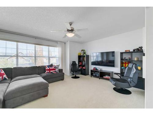48 Auburn Sound Crescent Se, Calgary, AB - Indoor Photo Showing Living Room
