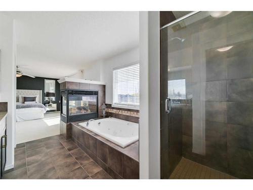 48 Auburn Sound Crescent Se, Calgary, AB - Indoor Photo Showing Bathroom With Fireplace
