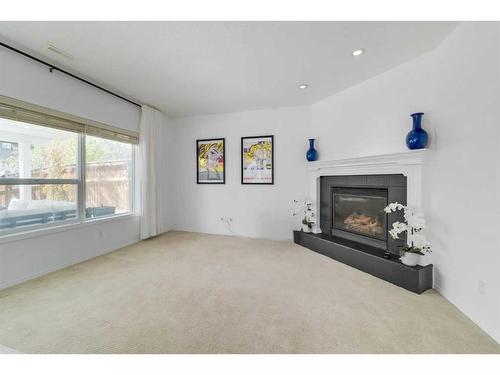 48 Auburn Sound Crescent Se, Calgary, AB - Indoor Photo Showing Other Room With Fireplace