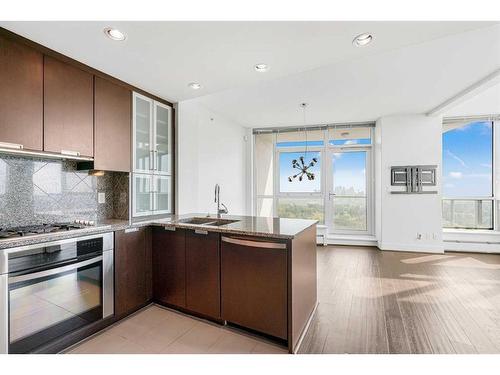 2102-99 Spruce Place Sw, Calgary, AB - Indoor Photo Showing Kitchen With Double Sink With Upgraded Kitchen