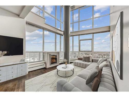 2102-99 Spruce Place Sw, Calgary, AB - Indoor Photo Showing Living Room With Fireplace