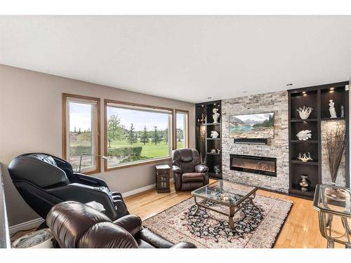 243127 Range Road 281A, Rural Rocky View County, AB - Indoor Photo Showing Living Room With Fireplace