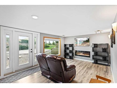 243127 Range Road 281A, Rural Rocky View County, AB - Indoor Photo Showing Living Room With Fireplace