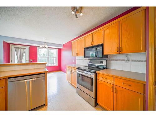 49 Rocky Ridge Green Nw, Calgary, AB - Indoor Photo Showing Kitchen