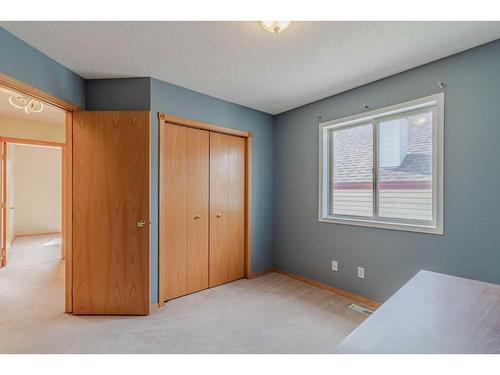 49 Rocky Ridge Green Nw, Calgary, AB - Indoor Photo Showing Other Room