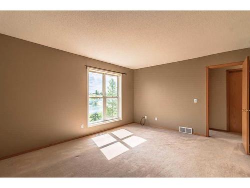 49 Rocky Ridge Green Nw, Calgary, AB - Indoor Photo Showing Other Room