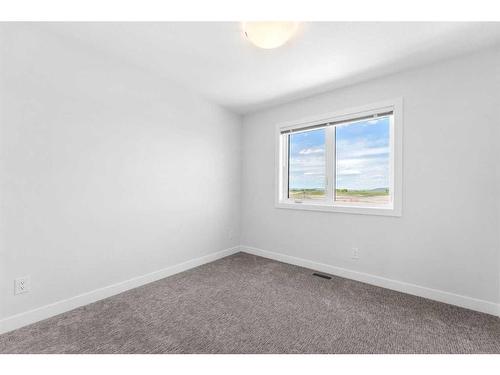 1078 Harmony Parade, Rural Rocky View County, AB - Indoor Photo Showing Bedroom