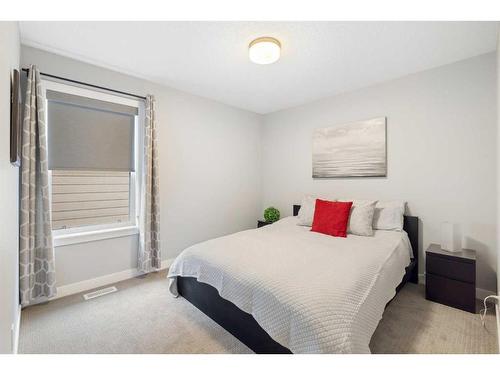 711 Shawnee Drive Sw, Calgary, AB - Indoor Photo Showing Bedroom