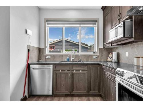 734 Redstone Drive Ne, Calgary, AB - Indoor Photo Showing Kitchen With Stainless Steel Kitchen