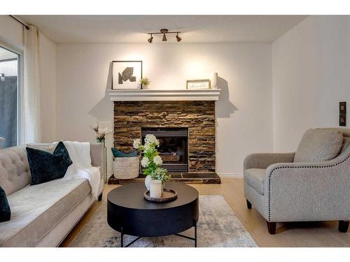 13 Inverness Rise Se, Calgary, AB - Indoor Photo Showing Living Room With Fireplace