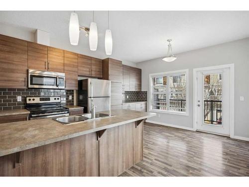 333-130 New Brighton Way Se, Calgary, AB - Indoor Photo Showing Kitchen With Double Sink With Upgraded Kitchen