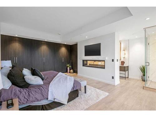 708-1020 9 Avenue Se, Calgary, AB - Indoor Photo Showing Bedroom With Fireplace