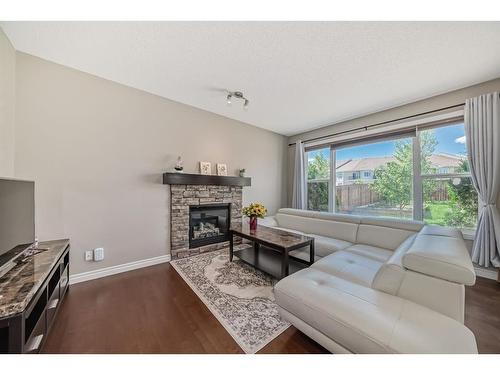 41 Sherwood Heights Nw, Calgary, AB - Indoor Photo Showing Living Room With Fireplace
