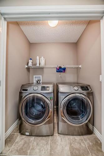 41 Sherwood Heights Nw, Calgary, AB - Indoor Photo Showing Laundry Room
