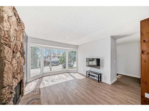 42 Dalhousie Crescent Nw, Calgary, AB - Indoor Photo Showing Living Room With Fireplace