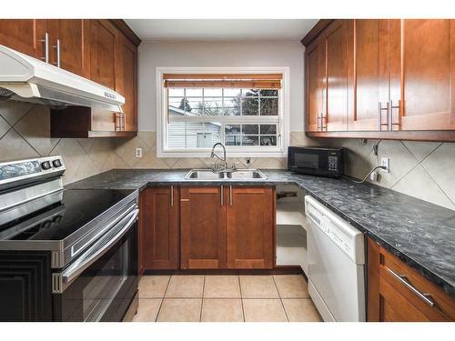 4807 Brisebois Drive Nw, Calgary, AB - Indoor Photo Showing Kitchen With Double Sink