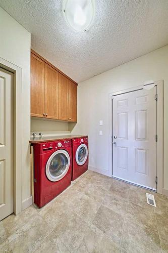 12 Crestmont Way Sw, Calgary, AB - Indoor Photo Showing Laundry Room