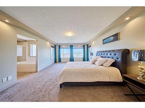 12 Crestmont Way Sw, Calgary, AB - Indoor Photo Showing Bedroom