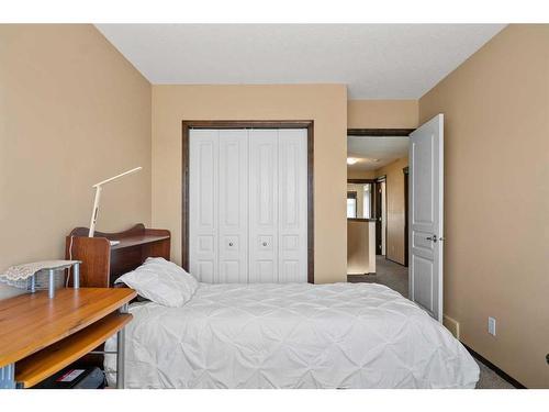 735 New Brighton Drive Se, Calgary, AB - Indoor Photo Showing Bedroom