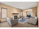 735 New Brighton Drive Se, Calgary, AB  - Indoor Photo Showing Living Room With Fireplace 