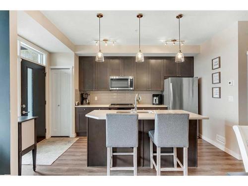 101-30 Shawnee Common Sw, Calgary, AB - Indoor Photo Showing Kitchen With Stainless Steel Kitchen With Upgraded Kitchen