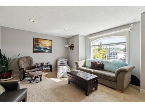 431 Rocky Ridge Drive Nw, Calgary, AB - Indoor Photo Showing Living Room