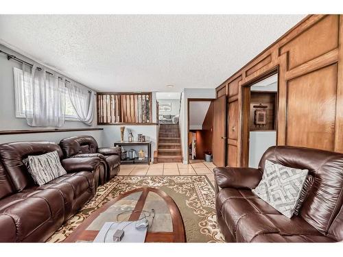 6732 34 Avenue Ne, Calgary, AB - Indoor Photo Showing Living Room With Fireplace