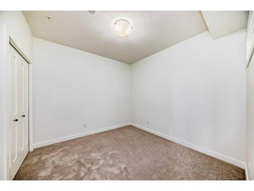 2210-55 Lucas Way Nw, Calgary, AB - Indoor Photo Showing Other Room