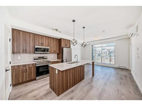 2210-55 Lucas Way Nw, Calgary, AB - Indoor Photo Showing Kitchen With Stainless Steel Kitchen With Upgraded Kitchen