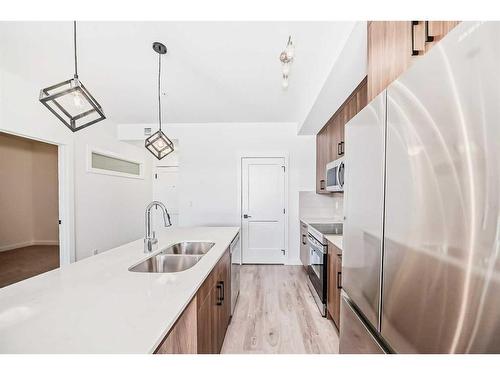 2210-55 Lucas Way Nw, Calgary, AB - Indoor Photo Showing Kitchen With Double Sink With Upgraded Kitchen