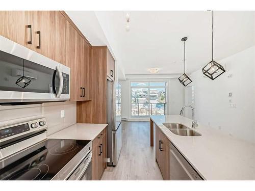 2210-55 Lucas Way Nw, Calgary, AB - Indoor Photo Showing Kitchen With Stainless Steel Kitchen With Double Sink With Upgraded Kitchen