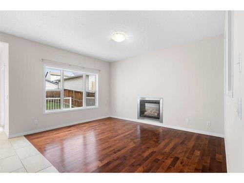 220 Covebrook Close Ne, Calgary, AB - Indoor Photo Showing Living Room With Fireplace