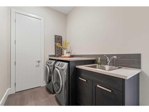229 Spring Water Close, Heritage Pointe, AB - Indoor Photo Showing Laundry Room