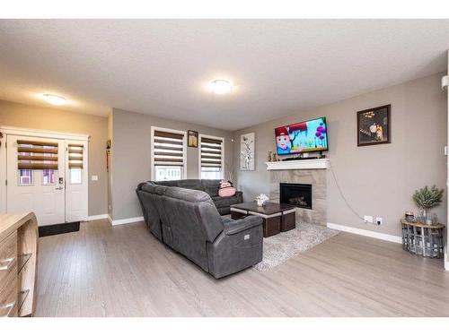 445 Redstone Grove Ne, Calgary, AB - Indoor Photo Showing Living Room With Fireplace