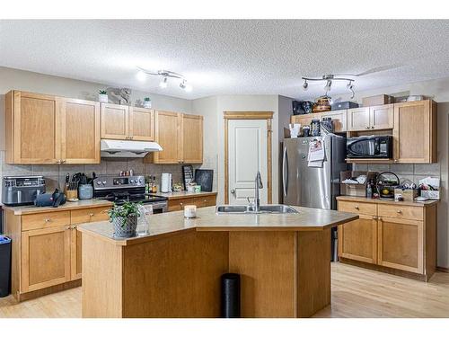 115 Panamount Heights Nw, Calgary, AB - Indoor Photo Showing Kitchen With Double Sink