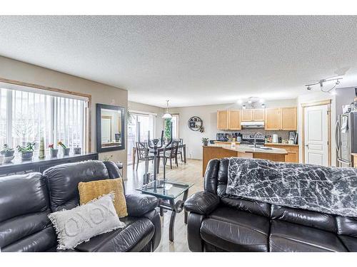 115 Panamount Heights Nw, Calgary, AB - Indoor Photo Showing Living Room