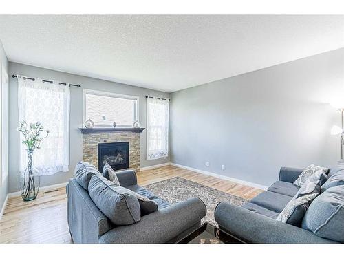 109 Brightonwoods Crescent Se, Calgary, AB - Indoor Photo Showing Living Room With Fireplace