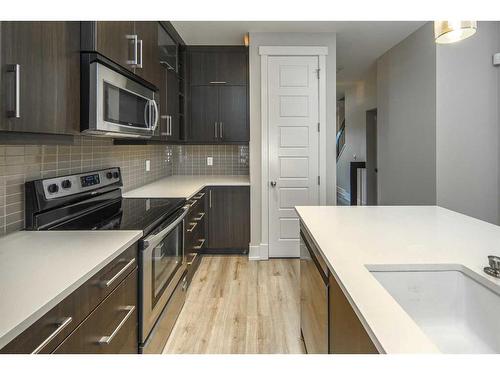 1104 17 Avenue Nw, Calgary, AB - Indoor Photo Showing Kitchen With Stainless Steel Kitchen With Upgraded Kitchen