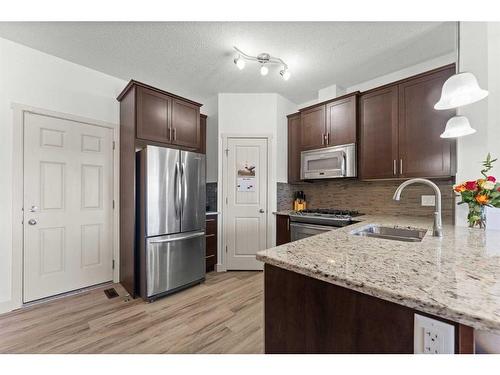 57 Copperpond Landing Se, Calgary, AB - Indoor Photo Showing Kitchen With Double Sink With Upgraded Kitchen