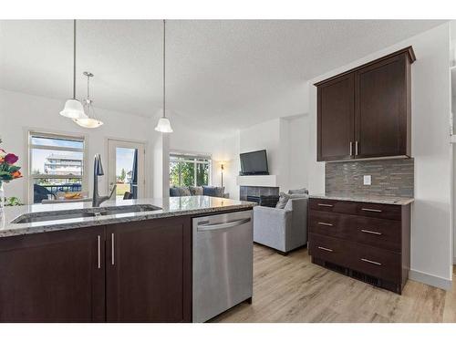 57 Copperpond Landing Se, Calgary, AB - Indoor Photo Showing Kitchen With Double Sink