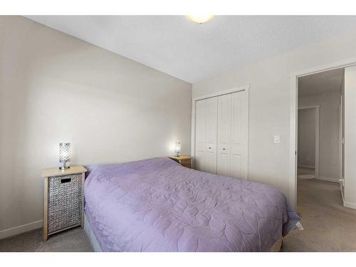 57 Copperpond Landing Se, Calgary, AB - Indoor Photo Showing Bedroom