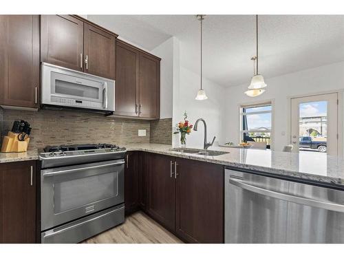 57 Copperpond Landing Se, Calgary, AB - Indoor Photo Showing Kitchen With Upgraded Kitchen