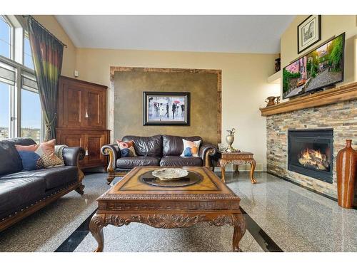 40 Panatella Manor Nw, Calgary, AB - Indoor Photo Showing Living Room With Fireplace