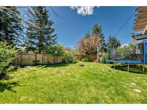 47 Woodmont Drive Sw, Calgary, AB - Outdoor With Backyard