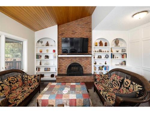 43 Woodbine Boulevard Sw, Calgary, AB - Indoor Photo Showing Living Room With Fireplace