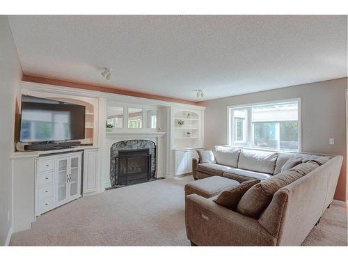 10827 Valley Springs Road Nw, Calgary, AB - Indoor Photo Showing Living Room With Fireplace