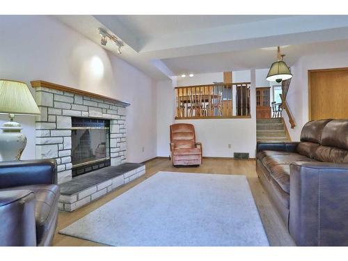 57 Macewan Ridge Circle Nw, Calgary, AB - Indoor Photo Showing Living Room With Fireplace