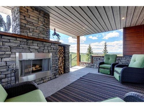 418145 48 Street West, Rural Foothills County, AB - Outdoor With Fireplace With Deck Patio Veranda With Exterior